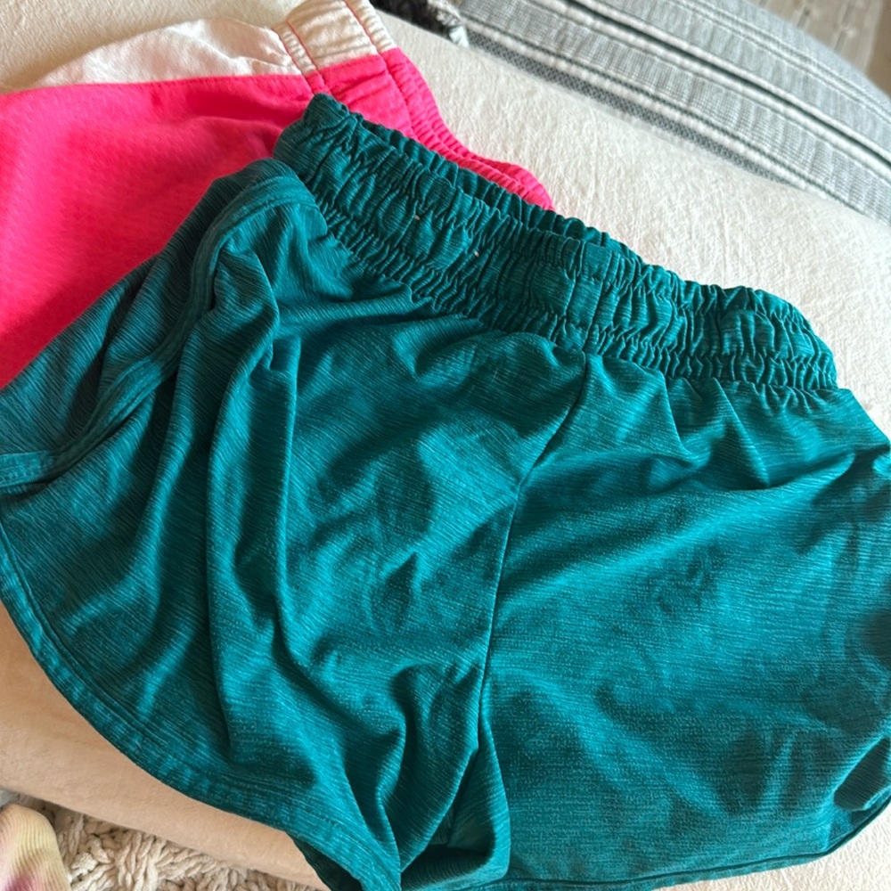 Girls shorts size 6x/7 like new one pair pink one pair green